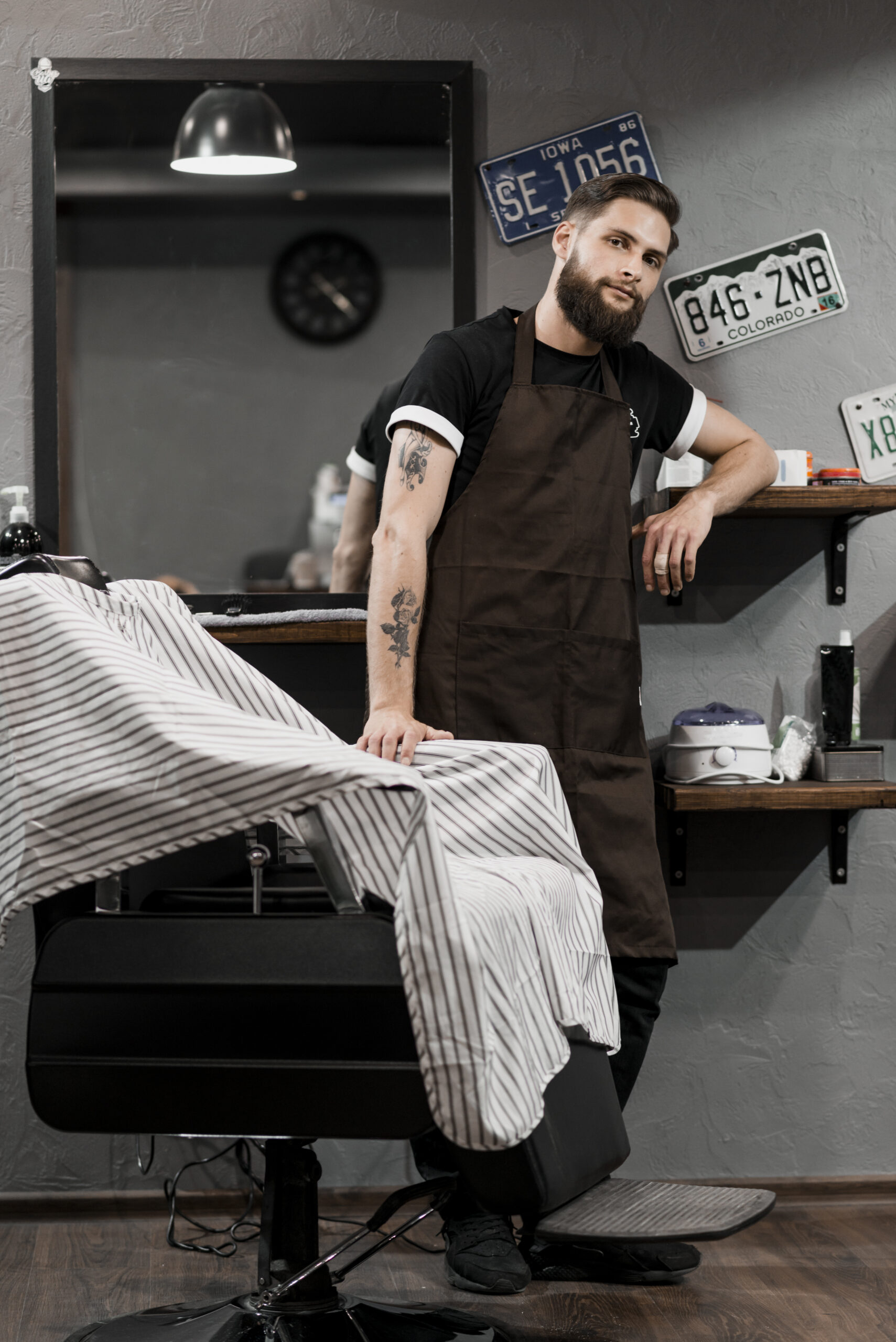 portrait-hairdresser-standing-barber-shop